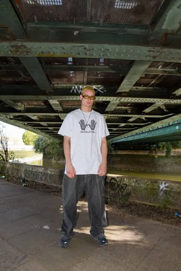 Ash Grey Graphic T-Shirt – “A Light Shines In The Darkness” - Image 2