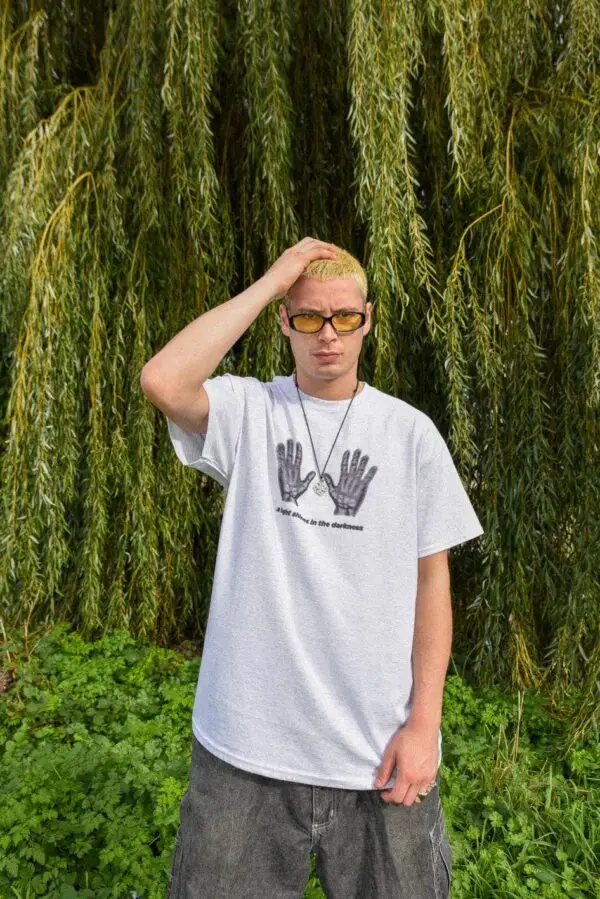 Ash Grey Graphic T-Shirt – “A Light Shines In The Darkness” - Image 4